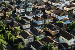 Aerial view of diverse residential neighborhood showing various types of housing properties. Photo by Gabriel Sollmann on Unsplash