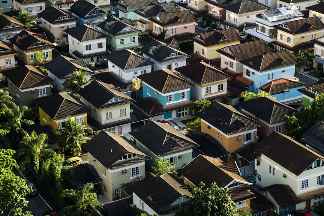 Aerial view of diverse residential neighborhood showing various types of housing properties. Photo by Gabriel Sollmann on Unsplash