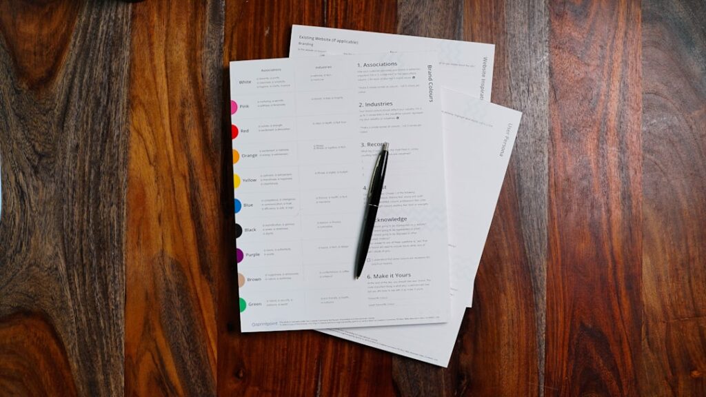 Stack of legal documents and forms on wooden table