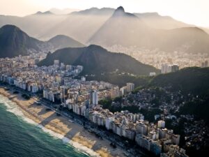 Aerial view of luxury high-rise residential buildings along the coast in Barra da Tijuca, Rio de Janeiro, showcasing the premium real estate market
