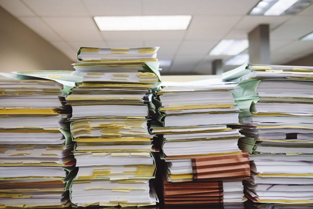 Stacks of organized legal documents and paperwork needed for usucapião process
